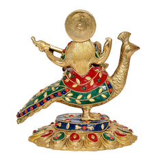 Brass Saraswati idol seen from back, swan tail visible, multicolor beaded detailing.