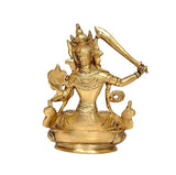Brass Manjushree statue back view, seated figure with attendant motifs and halo