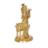Brass khaniya statue: back view of flute-playing figure on cow, detailed ornaments