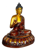 Brass seated Buddha idol, front-facing pose with raised blessing hand, lotus base