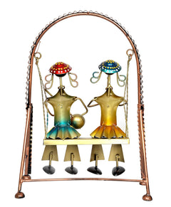 Jhula showpiece with two musician figures in gold tones, red and blue caps, four bells