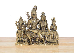Front view of 7-inch brass Shiv Parivar family idol, four figures in ornate attire