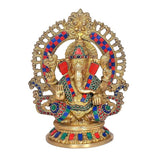 Gold-toned Ganesha statue with beaded trim, multicolor accents, wide decorative arch