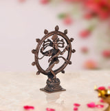 Copper dancing Shiva (Nataraja) idol with detailed ring and arms, standing on pedestal