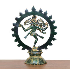 Rear view of dancing Shiva brass statue with green patina and halo ring above base
