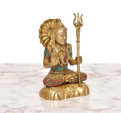 Brass Lord Shiva statue seated, profile face, trident raised, colorful ornaments