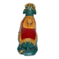 Nandi bull statue polyresin, rear view with red drape panel and gold borders