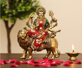 Brass Durga Maa idol seated on a lion, red and green adornments