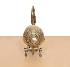 Brass conch shankh with round engraved body and finial on a small stand