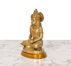 Brass Hanuman meditating idol, side view, ornate crown and robe detailing on base