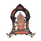 Brass Ganesh back view seated with arched halo, textured relief base