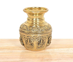 Bronze kalash side view showing engraved deities and geometric border design