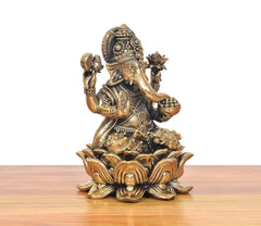 Bronze Ganesha idol angled view, seated on carved lotus with four detailed arms