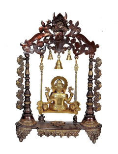 Brown Ganesha swing with gold-tone seated Ganesha, hanging bells and carved pillar legs