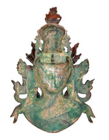 Brass Tara wall hanging mask back view with turquoise-green patina and embossed relief