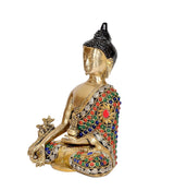Side view brass meditating Buddha figurine with jeweled chest and patterned base