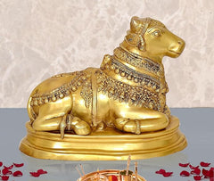 Brass Nandi cow statue idol on circular base, ornate engraved collar and ornaments