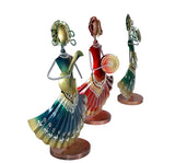 Iron folk musician set, side view showing drum and trumpet players in teal, red, and green