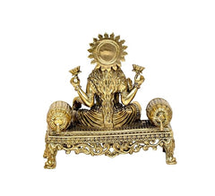 Back view brass Lakshmi idol with radiant crown above seated figure