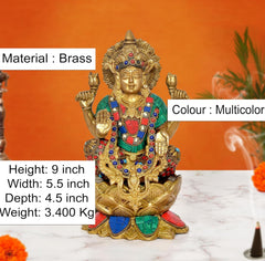 Brass Lakshmi idol on lotus with multicolored painted details, height 9 in