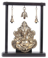 Ornate brass Ganesha idol wall hanging with dark wooden frame and bells