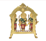 Back view of brass Ram Darbar statue with arched frame and central figure