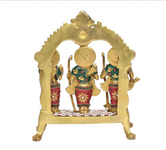 Back view of brass Ram Darbar statue with arched frame and central figure