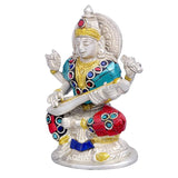 Brass Ganesha idol holding a long curved weapon, turquoise tunic, red pants, lotus base