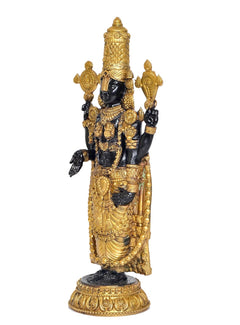 Side view of standing four-armed brass Balaji idol statue with gold crown and base