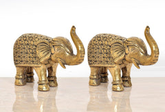 Brass elephant figurines, side view of 2 elephants with floral embossed panels