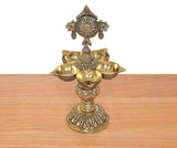 Bronze five-diya oil lamp stand with five bowl holders and engraved pedestal