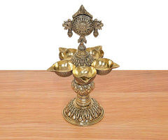 Bronze five-diya oil lamp stand with five bowl holders and engraved pedestal