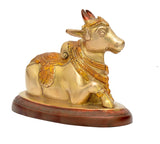 Brass Nandi bull statue, standing sideways view, ornate neck and chest ornaments