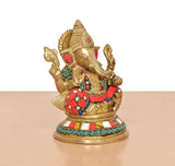 Brass Ganpati Bappa murti (6 inch) angled view, red and teal beaded ornaments
