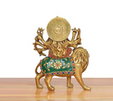 Brass Durga Maa lion idol, rear view, circular halo disc and painted dress details