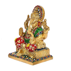 Messing-Ganesha-Statue im Seitenprofil, farbige Verzierungen, vier Arme, auf Sockel