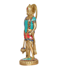 Brass Hanuman standing idol turned slightly, turquoise vest with red panels and jewelry