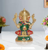 Sitting brass Lord Ganesha idol with green tunic, red skirt and gold detailing