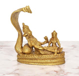 Golden brass Vishnu on Sheshnag with Lakshmi beside, detailed relief figures