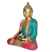 Side view of brass Buddha murti in bhumisparsha mudra, teal and red decorated robe