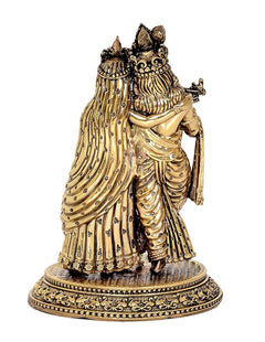 Brass Radha Krishna idol from side view, decorative etched round base