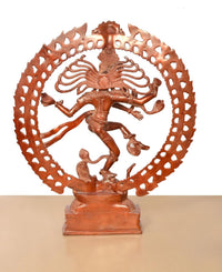 Orange brass Lord Shiva dancing idol, rear view showing multi-armed motif and arched ring