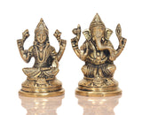 Brass Lakshmi and Ganesha figurines, frontal view with ornate detailing on round bases.