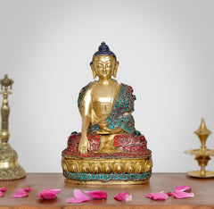 Messing-Buddha im Meditationssitz, Dhyan-Mudra, türkis/rot verziert