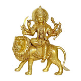 Brass Durga statue on lion with ornate crown and raised weapons
