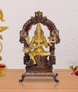 Brass handcrafted seated Saraswati idol with arched halo and ornate base