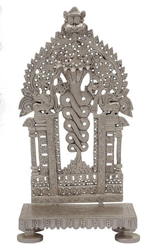 Antique brass deity throne chowki with Vasuki serpent, ornate cutout details front view