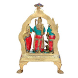 Ram Darbar statue from back view, multicolour robes and ornate brass arch frame