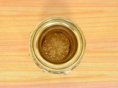 Top view of brass kalash opening with engraved lotus flower design