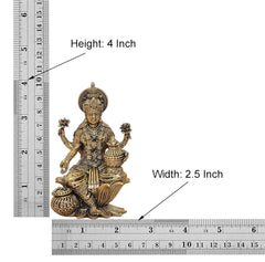 4 inch brass Lakshmi idol; height 4 in and width 2.5 in with measuring rulers